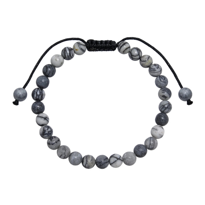 A close-up view of a black and gray network agate  bracelet, with 6mm round polished matte beads, and an adjustable pull-tie closure, on a white background.