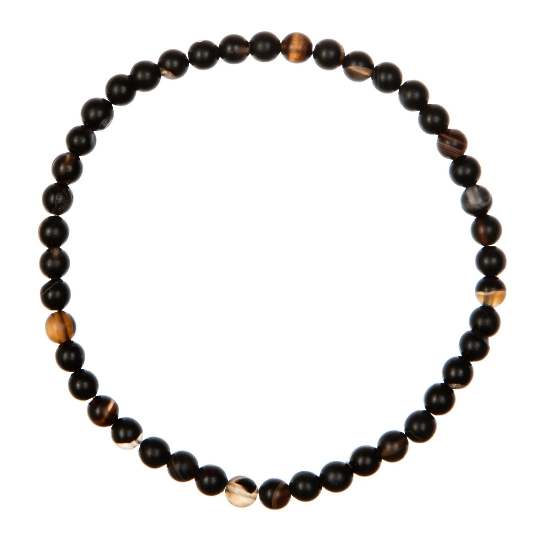 Black stripe agate stretch bracelet made with 6mm round varigated matte black beads with flecks of brown and tan, on a white background.