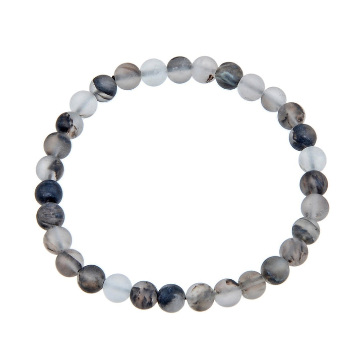 Close-up of a bracelet made with black watermelon stone 6mm beads in shades of white, gray, tan, and black, on a stretch cord, displayed against a white background.