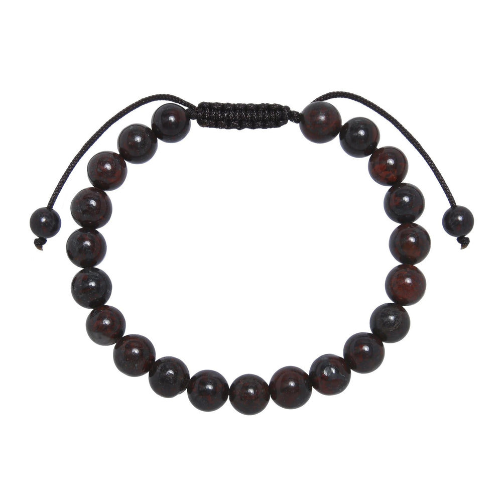 Close-up of a brecciated jasper bracelet made with 8mm round red brown beads and a dark brown pull tie style cord closure, displayed on a white background.
