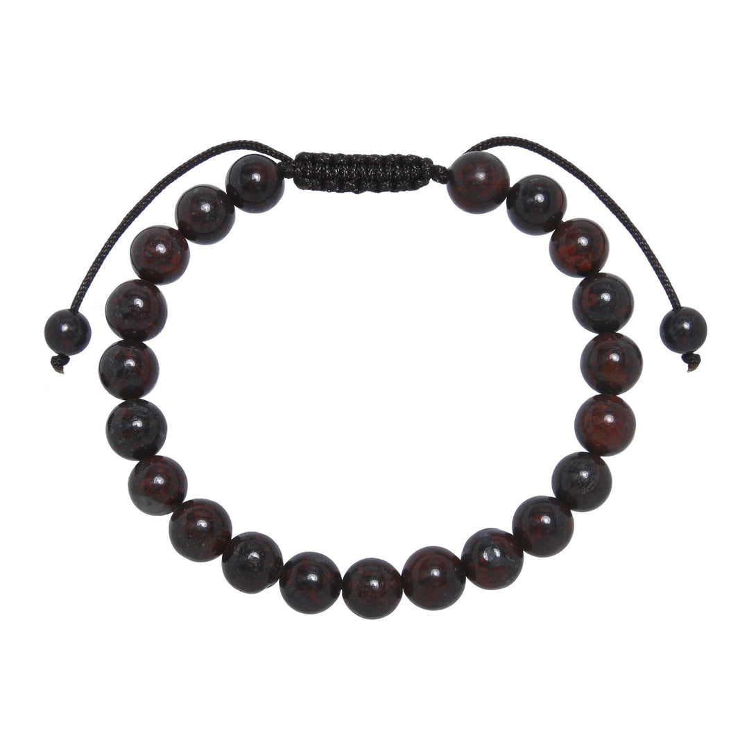 Close-up of a brecciated jasper bracelet made with 8mm round red brown beads and a dark brown pull tie style cord closure, displayed on a white background.