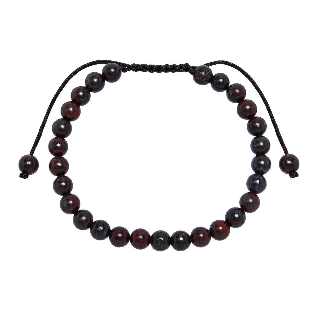 Close-up of a brecciated jasper bracelet made with 6mm round red brown beads and a dark brown pull tie style cord closure, displayed on a white background.