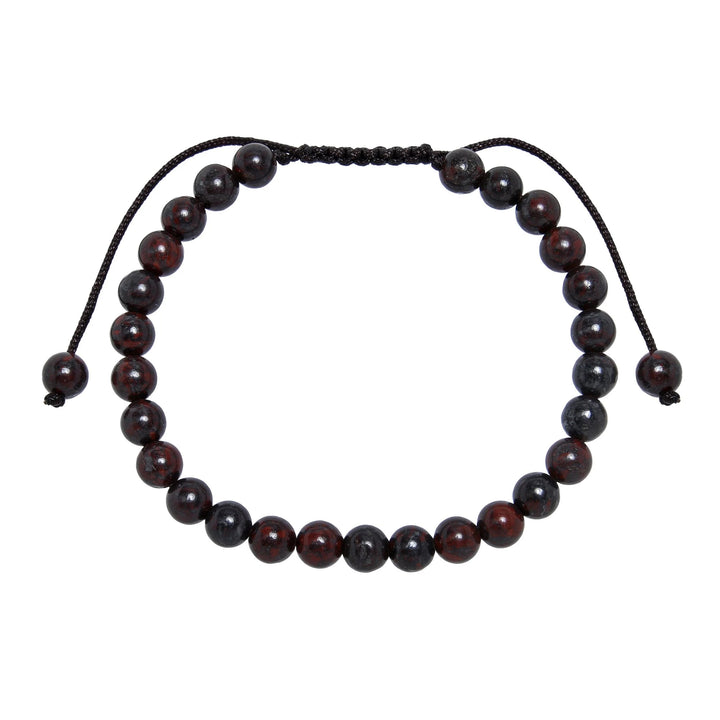 Close-up of a brecciated jasper bracelet made with 6mm round red brown beads and a dark brown pull tie style cord closure, displayed on a white background.