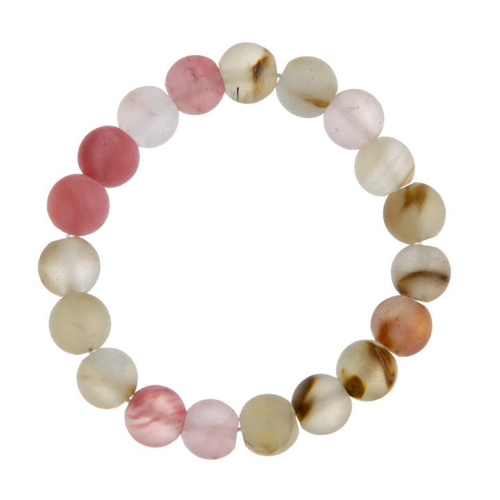 Close-up of a cherry quartz stretch style bracelet made with 10mm beads in shades of pink, tan, and white; displayed on a white background.