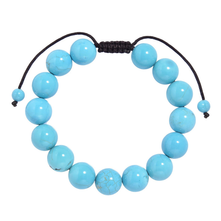 Close-up of a tcracked turquoise bracelet made with 12mm round turquoise colored beads with dark gray veins, and a dark brown pull tie style cord closure, displayed on a white background.