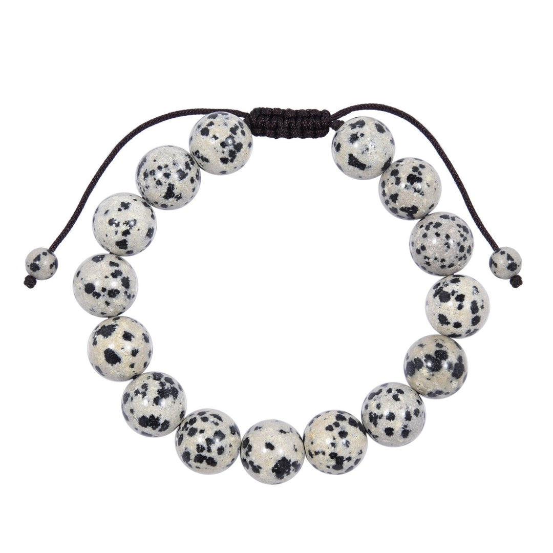 Close-up of a Dalmatian stone bracelet with a series of 12mm round beads featuring a black and white Dalmatian stone pattern,  with a dark brown pull tie cord displayed on a white background.