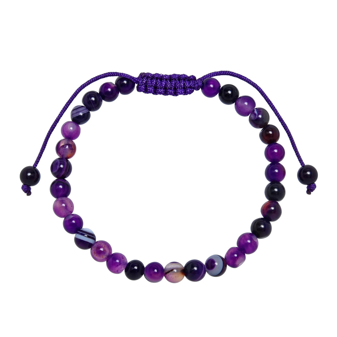 Close-up of a dog teeth amethyst bracelet made with 6mm round beads with shades of purple, and white colors, and a purple pull tie style cord closure, displayed on a white background.