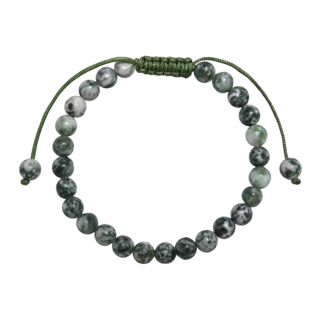 Close-up of a greenspot jasper bracelet made with 6mm round polished green and white spotted jasper beads, with a green pull tie style cord closure, displayed on a white background.