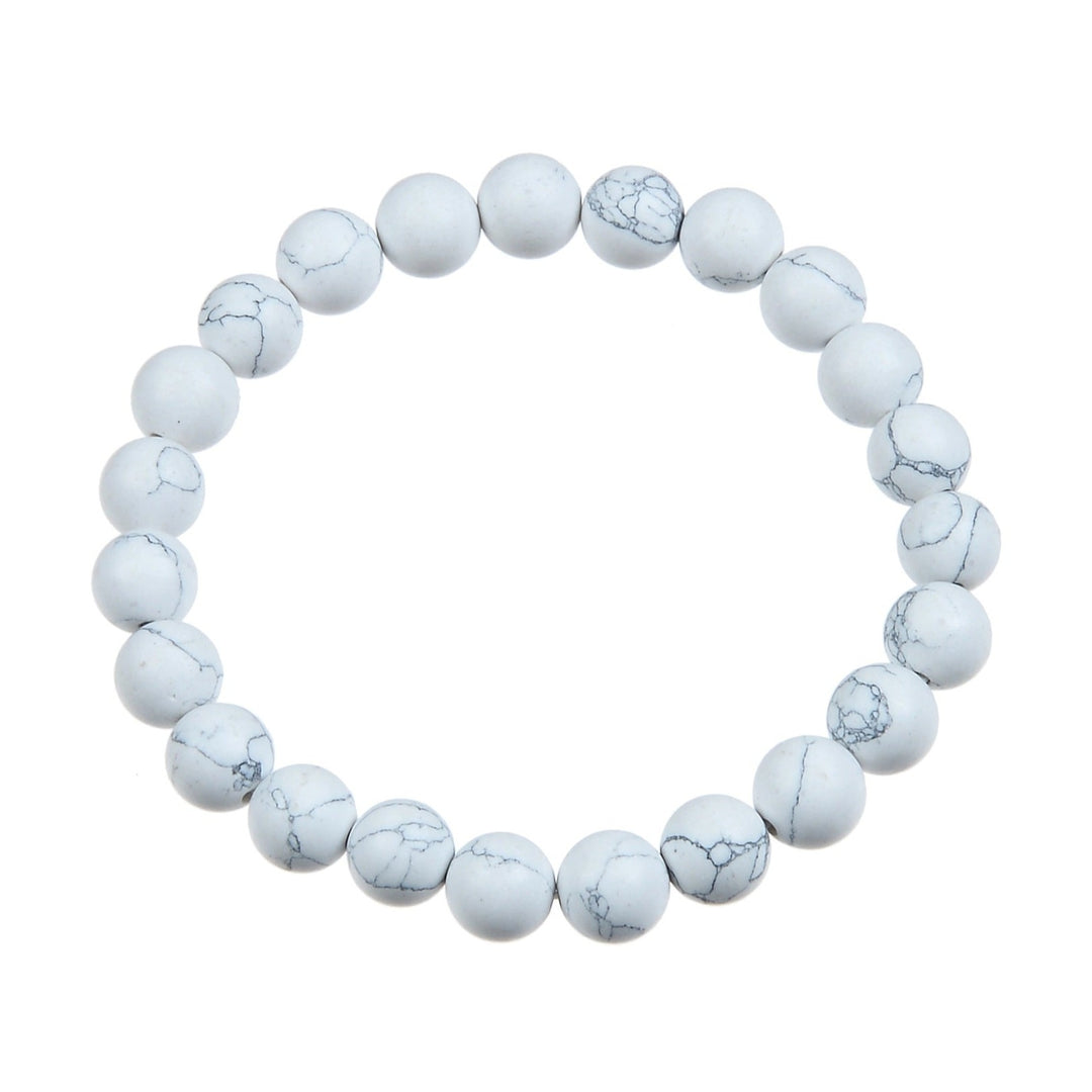 A bracelet made with 8mm round howlite stone beads, stretch style, in white and gray colors, displayed on a white background.
