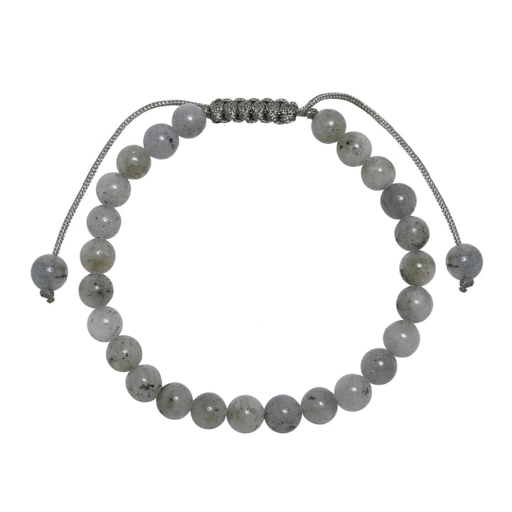 Close-up of a labradorite bracelet made with 6mm round polished gray beads and a gray pull tie style cord closure, displayed on a white background.