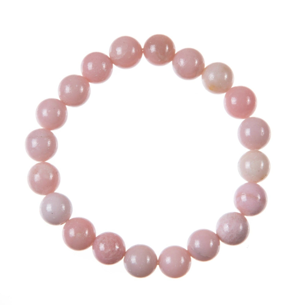Close-up of a bracelet made with pink opal stone 10mm beads on a stretch cord, displayed against a white background.