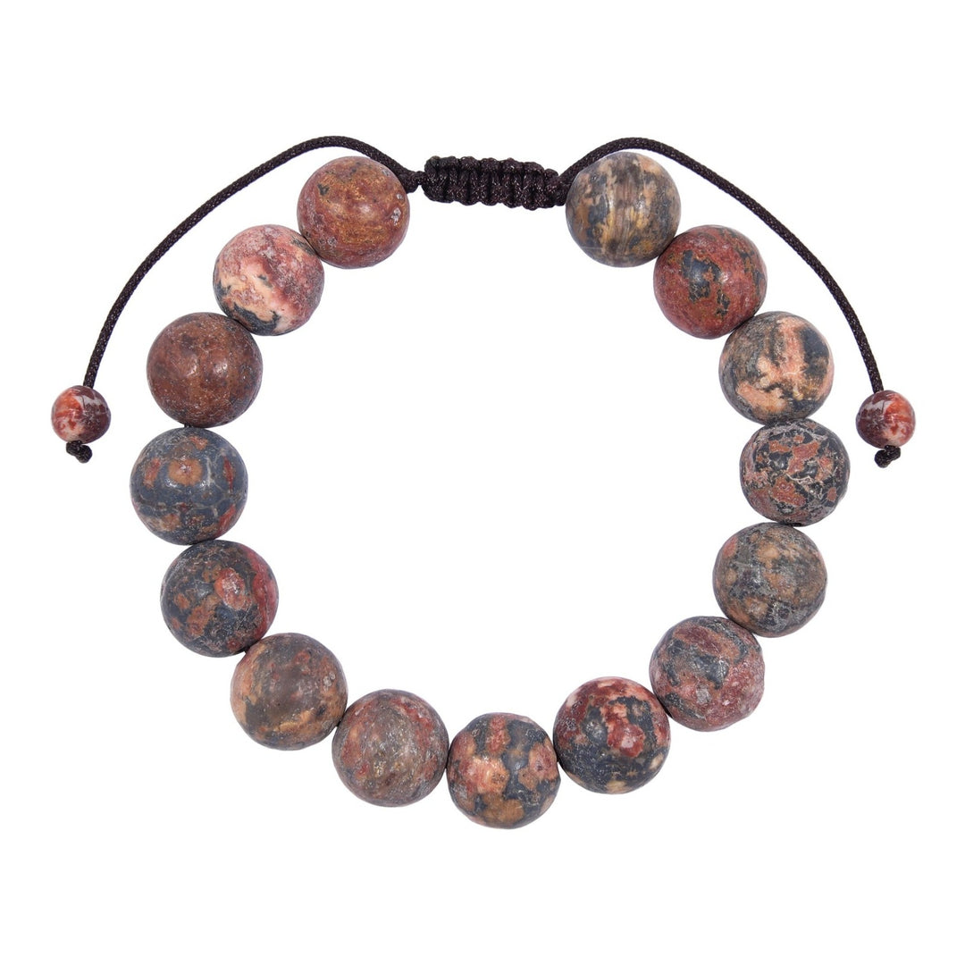 Close-up of a Red Leopard Skin Jasper  bracelet made with 12mm round beads with shades of pink and gray colors, and a dark brown pull tie style cord closure, displayed on a white background.