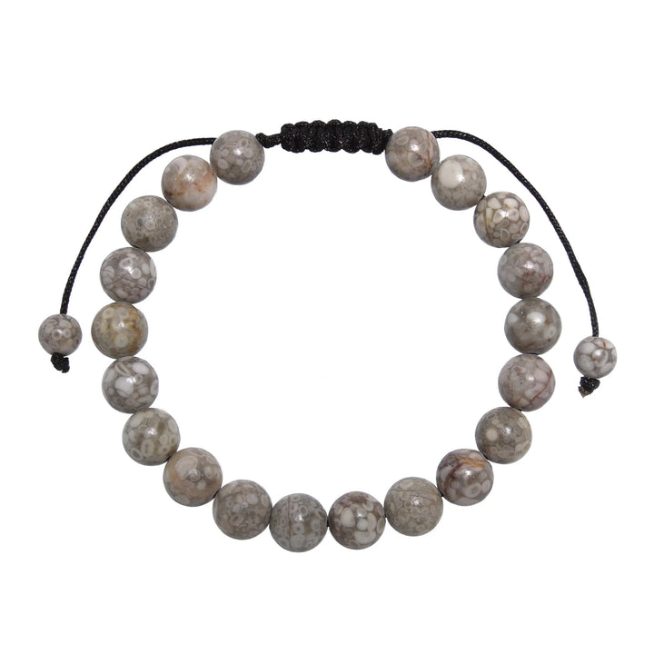 Close-up of a tree agate bracelet made with 8mm round beads with shades of gray and tan colors, and a dark brown black pull tie style cord closure, displayed on a white background.