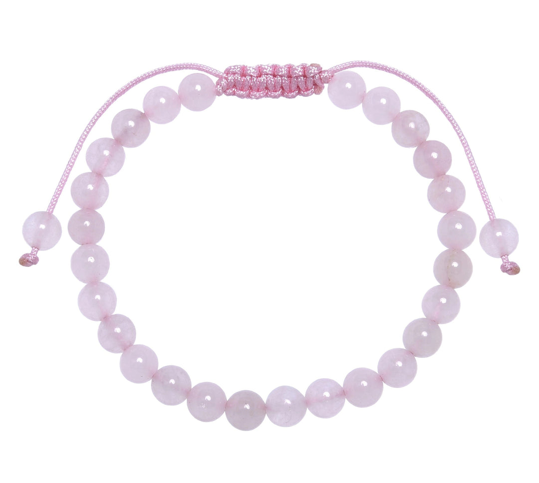 Close-up of a rose quartz bracelet made with 6mm round pink beads with a pink pull tie style cord closure, displayed on a white background.