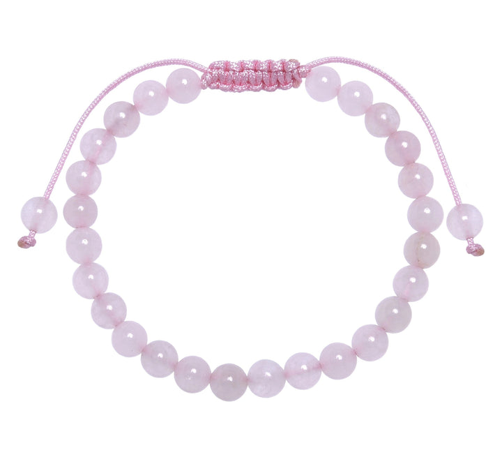 Close-up of a rose quartz bracelet made with 6mm round pink beads with a pink pull tie style cord closure, displayed on a white background.