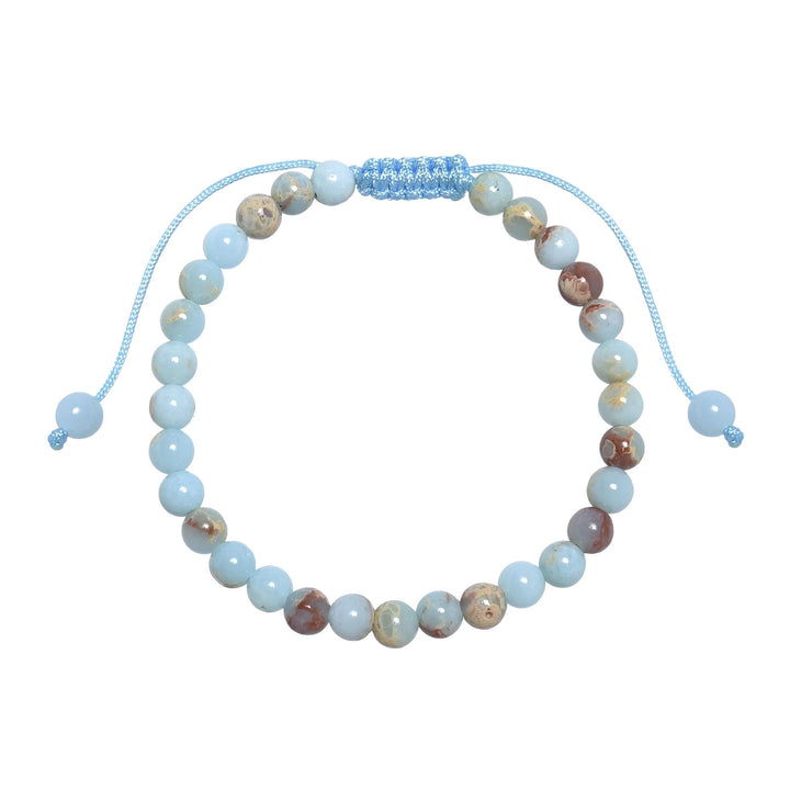 Close-up of a shoushan stone bracelet made with 6mm round polished beads with shades of light blue colors, tan, red, and cream, and a blue pull tie style cord closure, displayed on a white background.