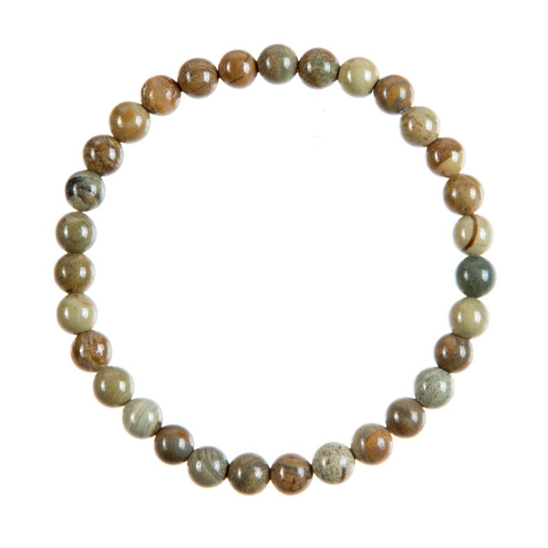 A close-up of a silver leaf jasper stretch style bracelet made with 6mm round jasper beads in shades of brown, green, and beige; strung on a clear stretch cord, displayed on a white background.