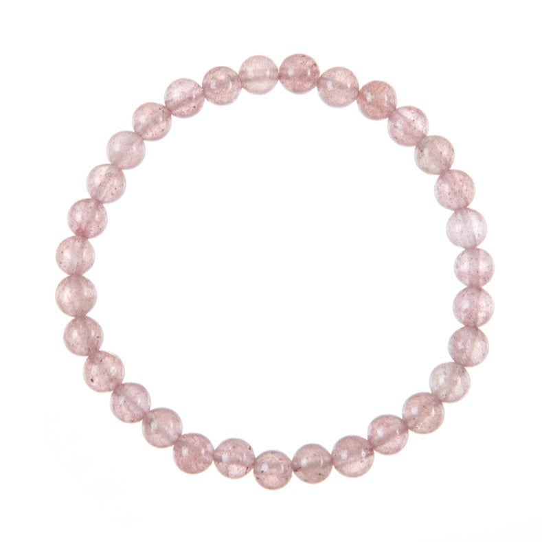 Close-up of a pink Strawberry Quartz stretch style bracelet made with 6mm round polished rose pink colored beads, strung on a clear stretch cord, displayed on a white background.