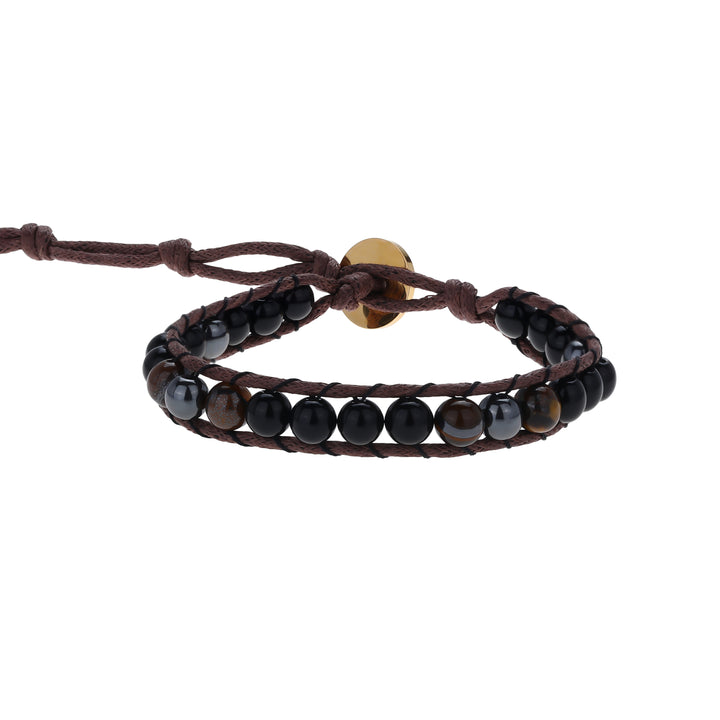 Close-up of a wrap style bead bracelet made with 6mm tiger's eye, black onyx, and hematite beads, in black, brown and dark gray colors, strung on an adjustable brown cord, with a gold button closure, displayed on a white background.
