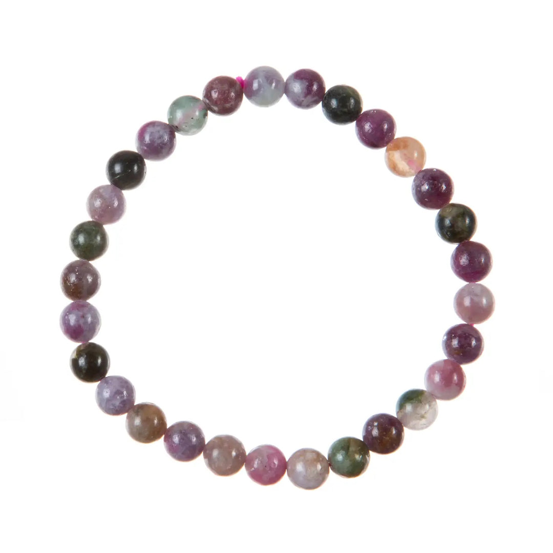 A bracelet made with 6mm round tourmaline beads, stretch style, in shades of purple, green, pink, and tan colors, displayed on a white background.