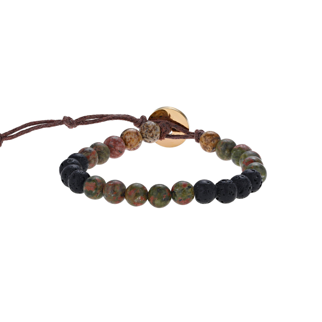 Close-up of a bead bracelet made with 6mm unakite and lava stone beads, in shades of green, black, and tan colors, strung on an adjustable brown cord, with a gold lbutton closure, displayed on a white background.