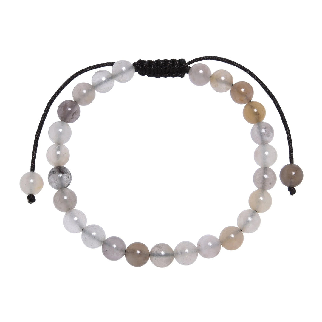Close-up of a violet jasper bracelet made with a combination of gray, white, violet, and beige 6mm violet jasper beads, with a dark brown black pull tie style cord closure, displayed on a white background.
