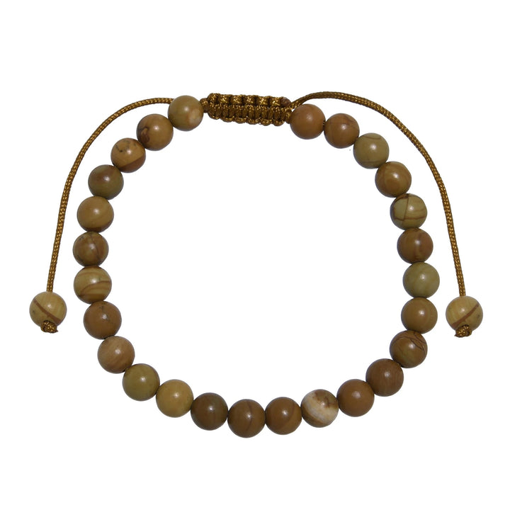 Close-up of a woodline jasper bracelet made with 6mm round polished brown  beads that look like wood, with a brown pull tie style cord closure, displayed on a white background.