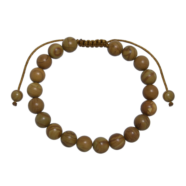 Close-up of a woodline jasper bracelet made with 8mm round polished brown  beads that look like wood, with a brown pull tie style cord closure, displayed on a white background.