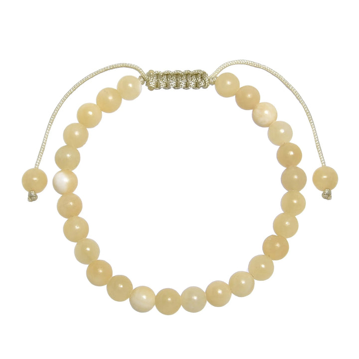 Close-up of a yellow jade bracelet made with 6mm round yellow jade beads, with a pastel yellow pull tie style cord closure, displayed on a white background.
